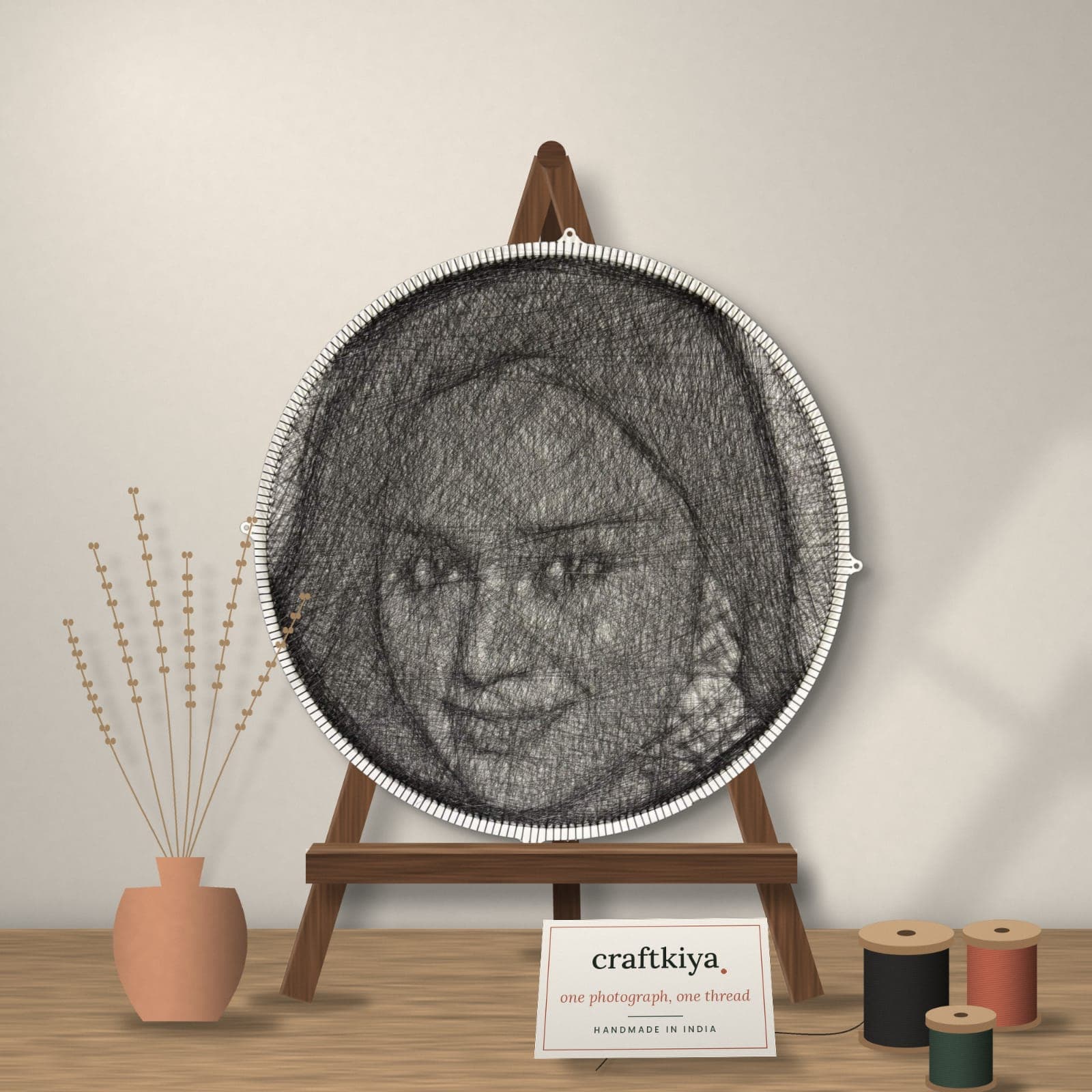 A finished Craftkiya string-art portrait on a wooden easel, handmade in India