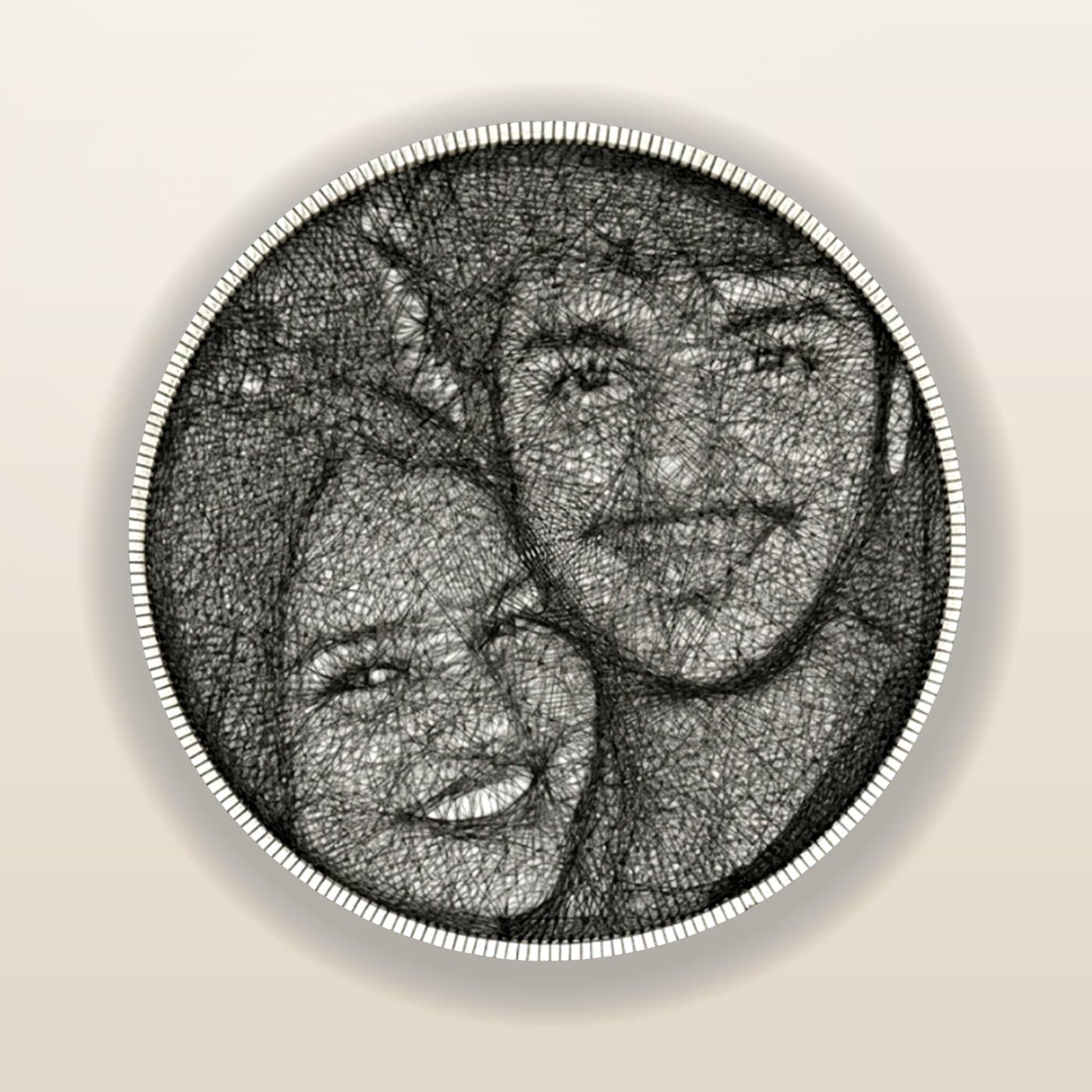 A hand-threaded string-art portrait of a smiling couple in a 24-inch circle