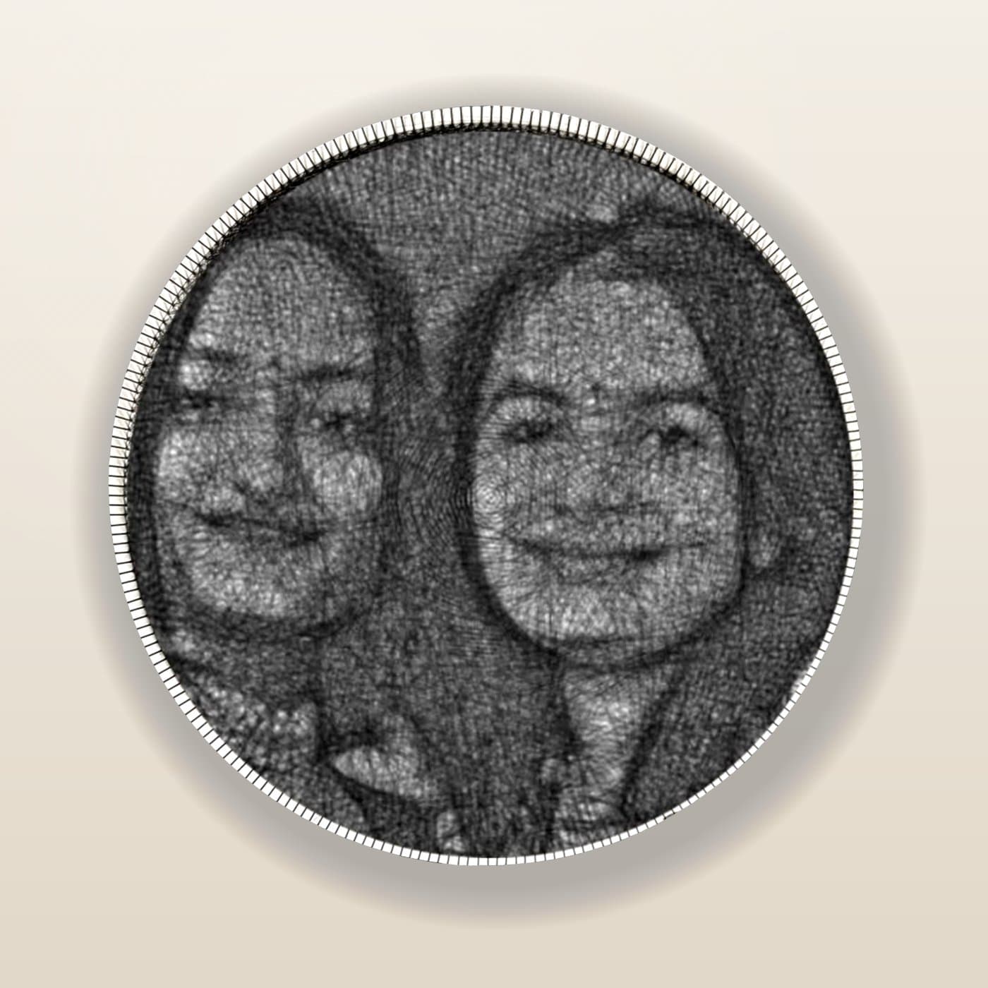 A hand-threaded string-art portrait of two best friends smiling together